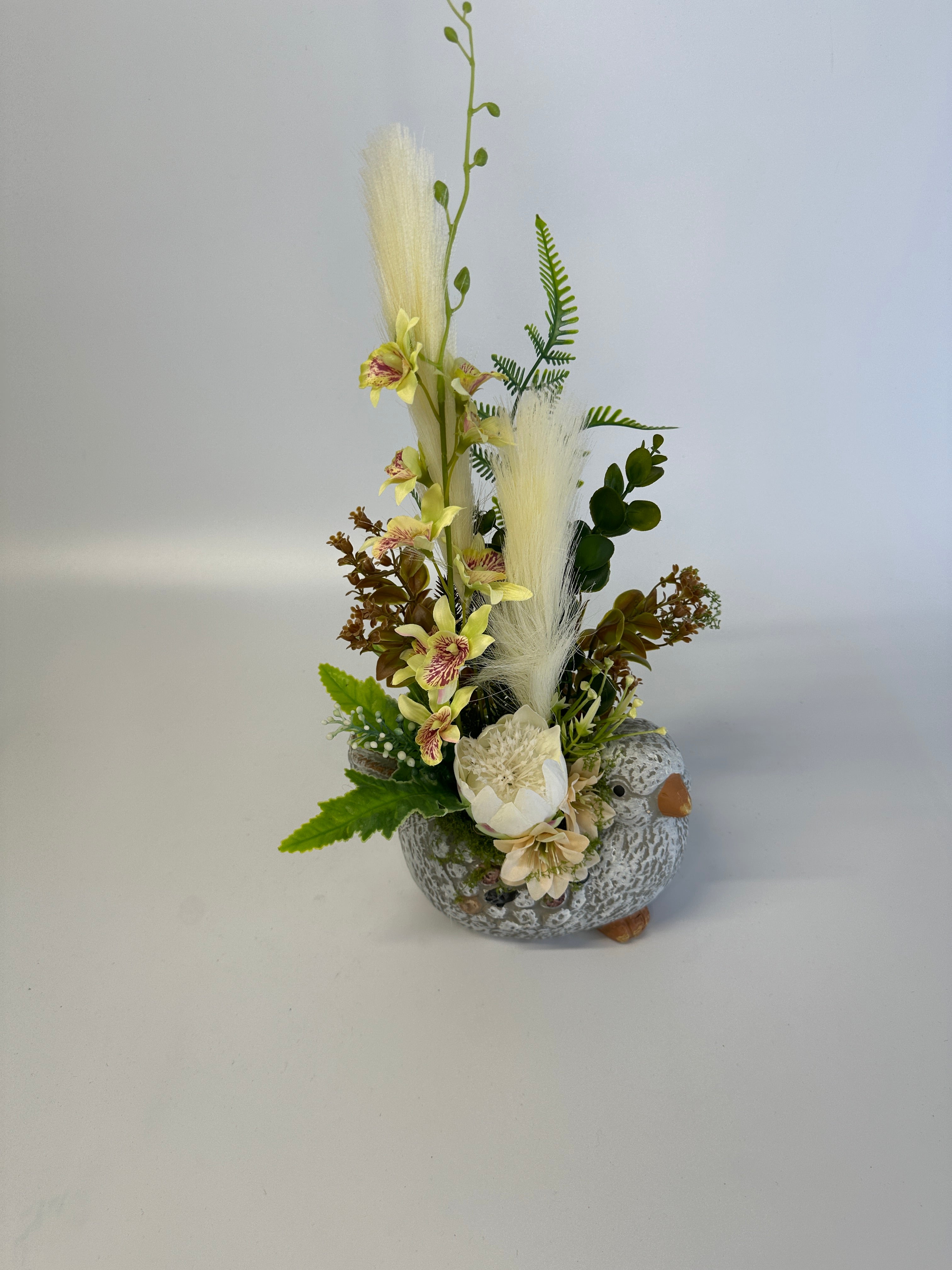 Ceramiczny ptaszek z kwiatami