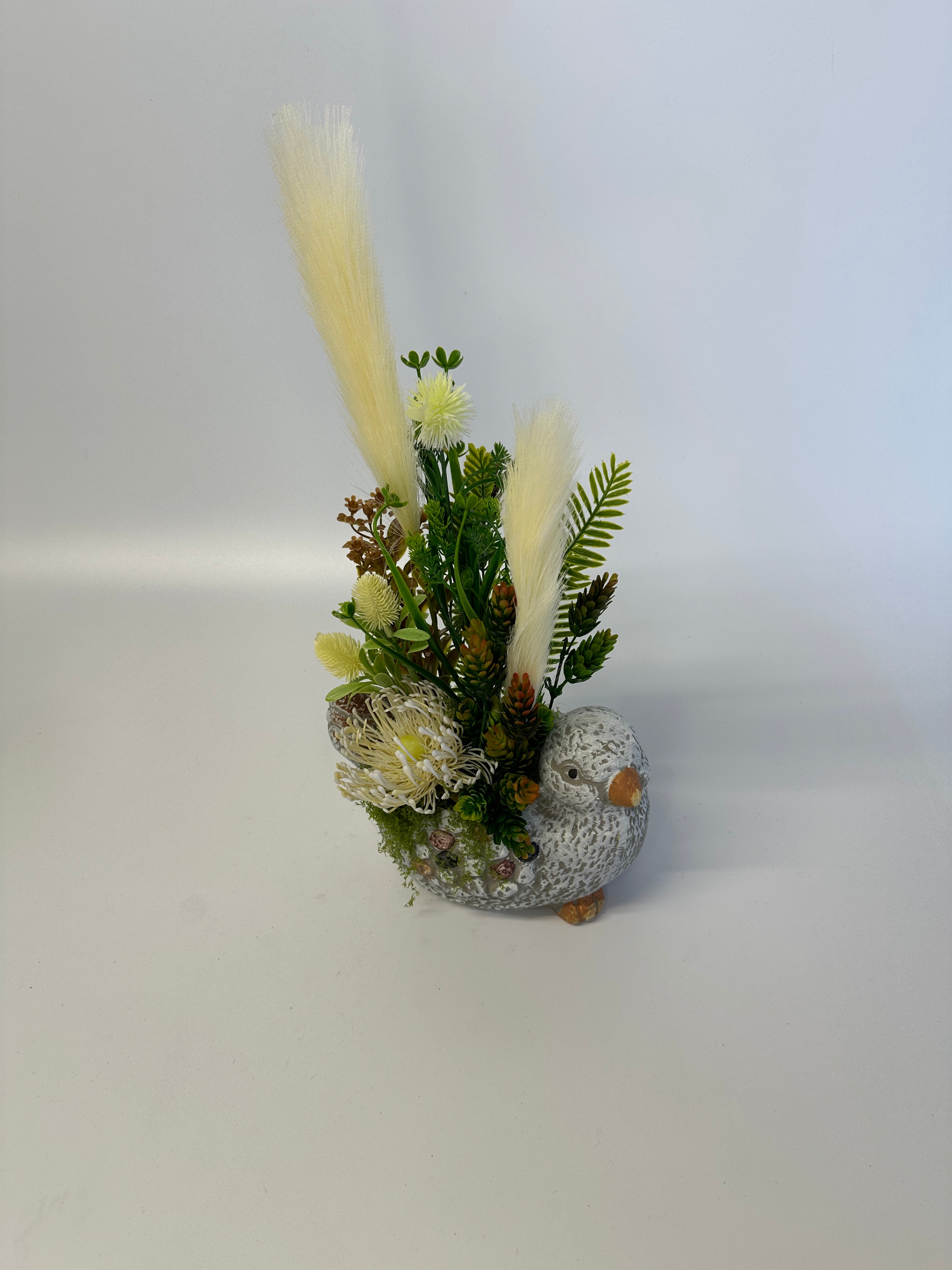 Ceramiczny ptaszek z kwiatami